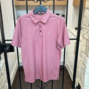zinnia polo from Travis Mathew in good condition but has a small needle hole